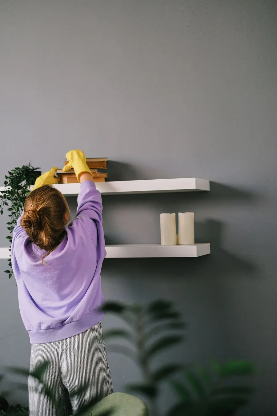 Dusting the shelves in a home