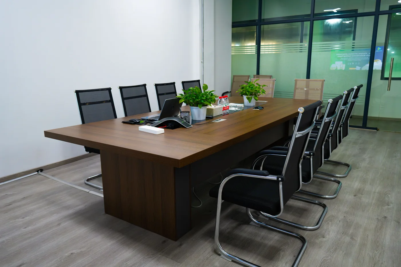 Office meeting room with a long table and chairs